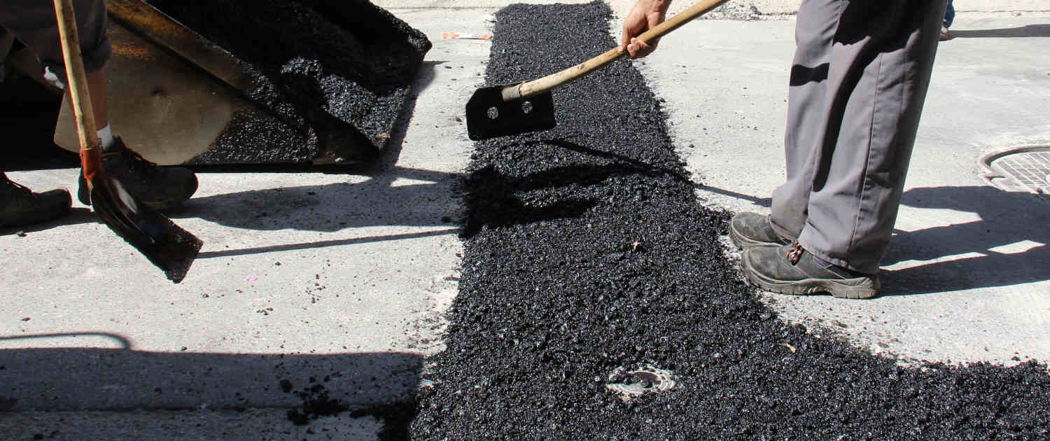 Asphalt being repaired